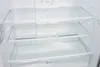 The interior of a clean, empty refrigerator with glass shelves. Produktbild-Vorschau