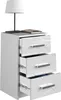 A white, high-gloss bedside table with three drawers and silver handles, shown against a white background. A lamp and two books are on top of the table. Anteprima dell’immagine prodotto