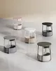 A collection of five small round side tables with integrated power outlets. Náhled obrázku produktu