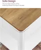 Close-up of the rounded corner of a wooden tabletop on a white furniture piece. Anteprima dell’immagine prodotto