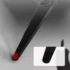 A close-up view of the bottom of a black monitor stand with a red rubber foot. Produktbild-Vorschau