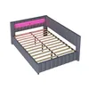 A gray upholstered bed frame with a slatted mattress support and a pink LED light strip integrated into the headboard. Náhled obrázku produktu