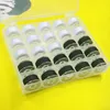 A clear plastic box containing spools of black and white thread, arranged in a grid. Produktbild-Vorschau