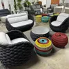 An indoor showroom displaying a set of outdoor furniture. Produktbild-Vorschau
