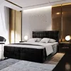 A luxurious bedroom with a large black bed as the centerpiece, decorated with gold accents and soft lighting. Produktbild-Vorschau