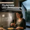 A woman is cooking in a modern kitchen with a new range hood installed. Produktbild-Vorschau