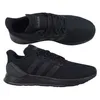 A pair of black Adidas sneakers shown from two different angles. Produktbild-Vorschau