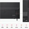 The image shows the back and side view of a television, highlighting its ports and connectivity options, along with icons representing different input types. Voir les images du produit