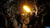 Three soldiers in a dark, organic-looking tunnel firing weapons at an unseen enemy. One soldier is using a flamethrower. Produktbild-Vorschau