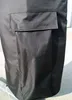 A close-up view of a black umbrella cover with a pocket. Produktbild-Vorschau