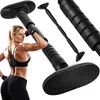 A woman is flexing her bicep next to a pull-up bar. Anteprima dell’immagine prodotto