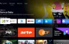 A screenshot of a smart TV interface displaying various apps and content. Produktbild-Vorschau