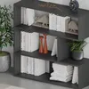 A modern, dark gray bookshelf filled with books and decorative items. Anteprima dell’immagine prodotto