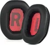 Two black ear pads with red inner lining are shown against a white background. The left ear pad has a red 'R' printed on the inner lining, and the right ear pad has a red 'L' printed on the inner lining. Podgląd zdjęcia produktu