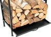 A close-up view of a black metal firewood rack filled with logs, featuring a pull-out drawer at the bottom. Podgląd zdjęcia produktu