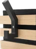 A close-up of a black coat hook mounted on wooden slats and black felt panels. Produktbild-Vorschau