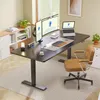 A modern home office setup with a standing desk, monitors, laptop, and chair. Produktbild-Vorschau