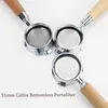 Three bottomless portafilters with wooden handles are arranged on a white background. Podgląd zdjęcia produktu