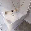 A modern bathroom with a white bathtub and marble walls. Produktbild-Vorschau