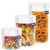 Three clear plastic food storage containers of varying sizes, filled with different food items, are arranged side-by-side against a white background. Produktbild-Vorschau