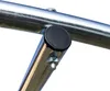 A close-up view of a metal frame with a black cap and a bolt. Produktbild-Vorschau