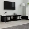 A modern living room setup featuring a wall-mounted TV above a long, black TV stand filled with books. Voir les images du produit
