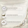 A close-up of a white pillow with informational labels attached. Produktbild-Vorschau