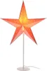 A decorative star-shaped lamp on a white stand. Náhled obrázku produktu