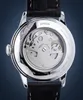 The back of a watch with a transparent case showing the internal mechanism. Produktbild-Vorschau