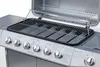 A close-up view of a gas grill with its lid open, showing the cooking grates and control knobs. Produktbild-Vorschau
