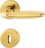 A brass door handle set with a keyhole escutcheon. Podgląd zdjęcia produktu