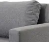 A close-up view of a gray fabric sofa, showing the texture of the material and the stitching on the armrest and cushion. Produktbild-Vorschau