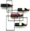 A black metal wine rack mounted on a white wall, holding four bottles of wine. Náhľad obrázku produktu