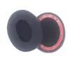 Two black ear pads for headphones are shown against a white background. Náhled obrázku produktu