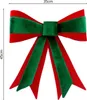 A decorative bow with red and green ribbons, with dimensions indicated. Produktbild-Vorschau