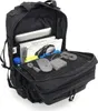 An open black backpack with various items inside, including a laptop, books, and accessories. Náhled obrázku produktu