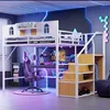 A modern gaming-themed bedroom with a loft bed, desk, and gaming chair. Produktbild-Vorschau