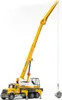 A toy crane truck with a load attached to its hook. Náhľad obrázku produktu