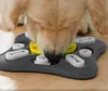 A dog is interacting with a puzzle feeder toy. Produktbild-Vorschau
