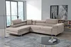 A modern living room with a large sectional sofa, coffee table, and bookshelf.
