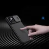 A hand is shown interacting with the back of a phone case, highlighting its texture and camera cover. Náhľad obrázku produktu