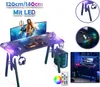 A collage of images showcasing a gaming desk with LED lighting, including close-ups of its features and a lifestyle shot of a gaming setup. Voir les images du produit