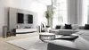A modern living room with a large sectional sofa, coffee table, and TV stand. Produktbild-Vorschau
