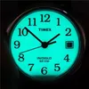 A close-up of a Timex watch face with the Indiglo backlight on. Produktbild-Vorschau