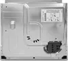 The back of a built-in oven, showing the electrical connection box and a label with installation instructions. Produktbild-Vorschau
