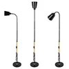 Three black floor lamps with wooden accents are displayed against a white background. Náhľad obrázku produktu