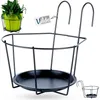 A black metal balcony railing planter holder with a green potted plant in the upper left corner and a smaller version of the planter in the lower right corner. Podgląd zdjęcia produktu