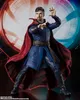 A Doctor Strange action figure posed in a dynamic stance against a colorful, abstract background. Podgląd zdjęcia produktu