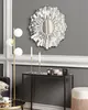 A modern living room setting with a decorative mirror, floor lamp, and console table. Náhľad obrázku produktu