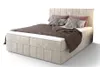 A boxspring bed with bedding and pillows, shown against a white background. Náhled obrázku produktu